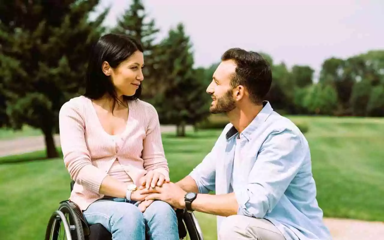 Participant smiling with their support worker